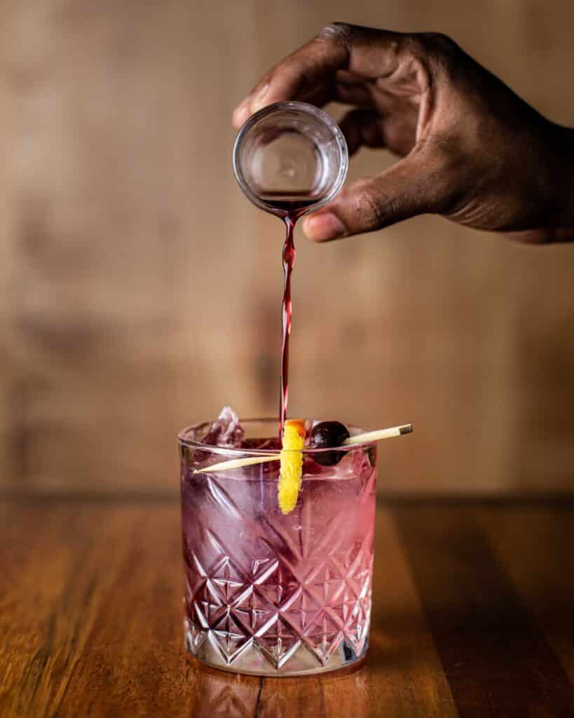 Housemade huckleberry Crème de Mure, Bar Boss™ Gin, fresh lemon